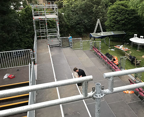 Integrated camera towers and tiered seating.